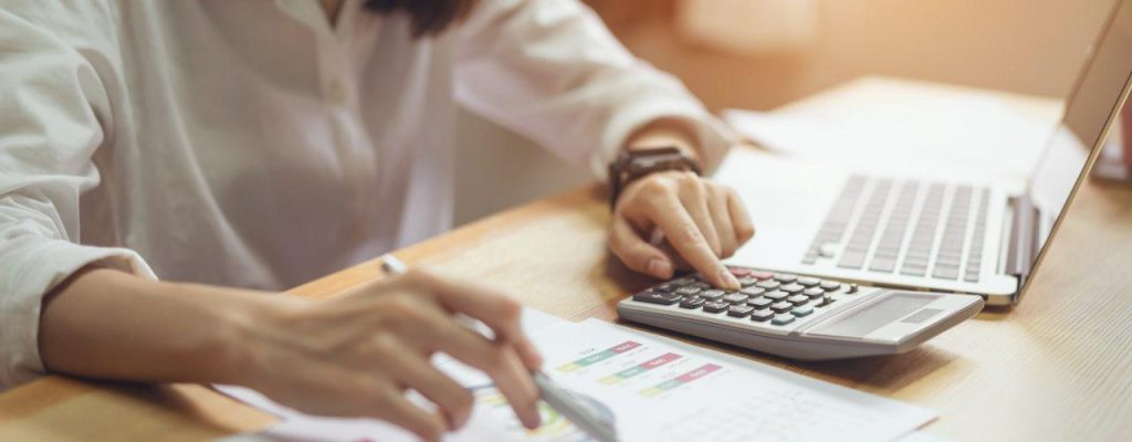 businesswoman-in-office-and-use-computer-and-calculator-to-perform-financial-accounting.jpg VAT Services